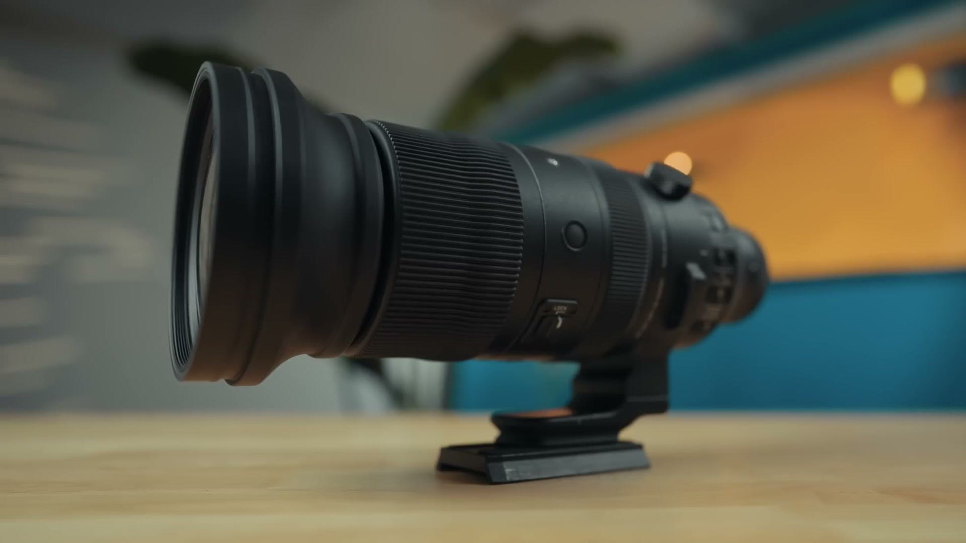 Sigma 60-600mm lens sitting on a table with its hood attached