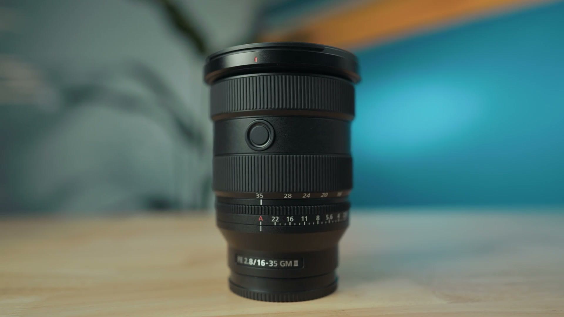 The Sony 16-35mm f/2.8 GM II lens standing on a table