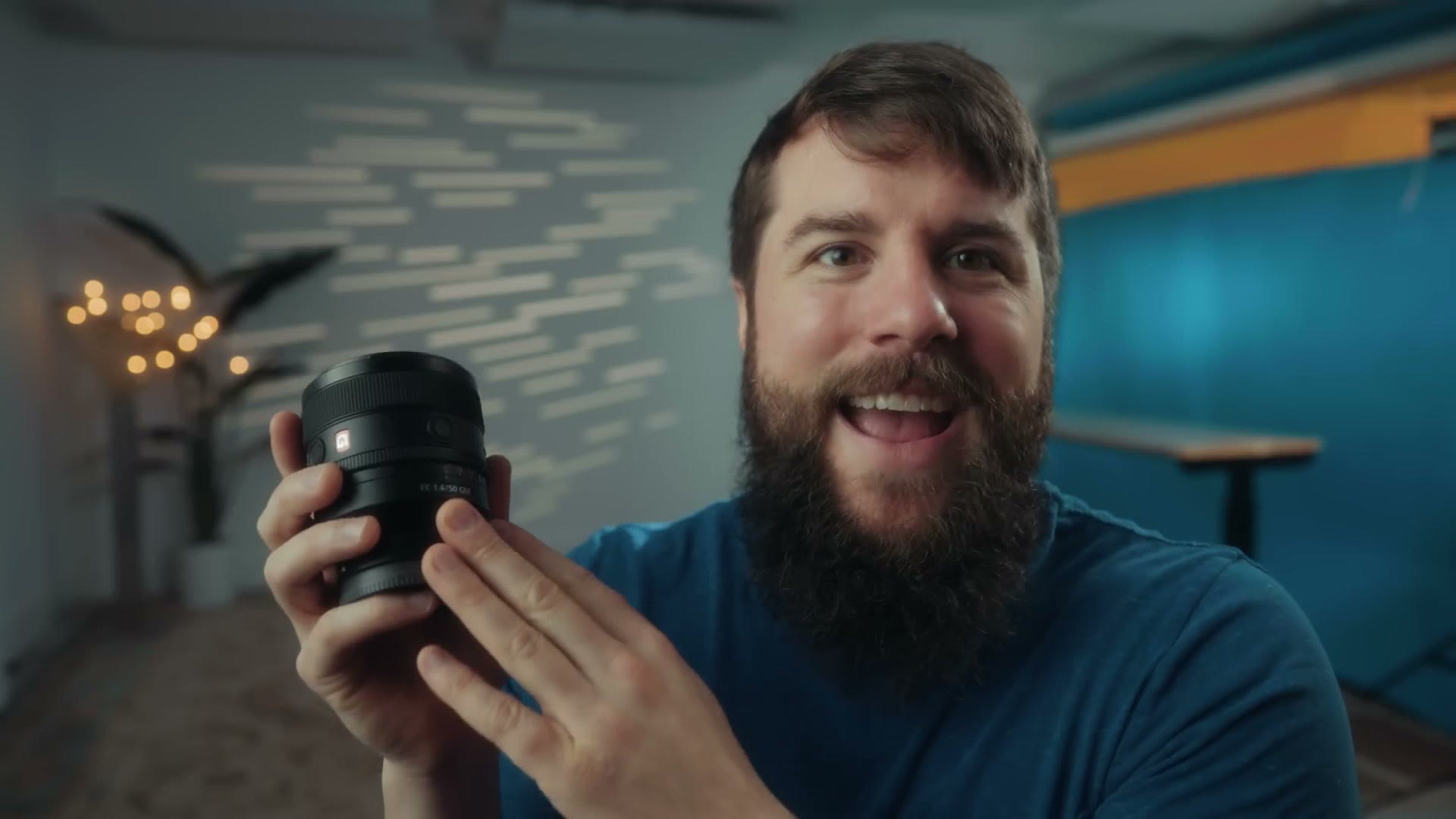 Matt Johnson holding the Sony 50mm f/1.4 GM lens