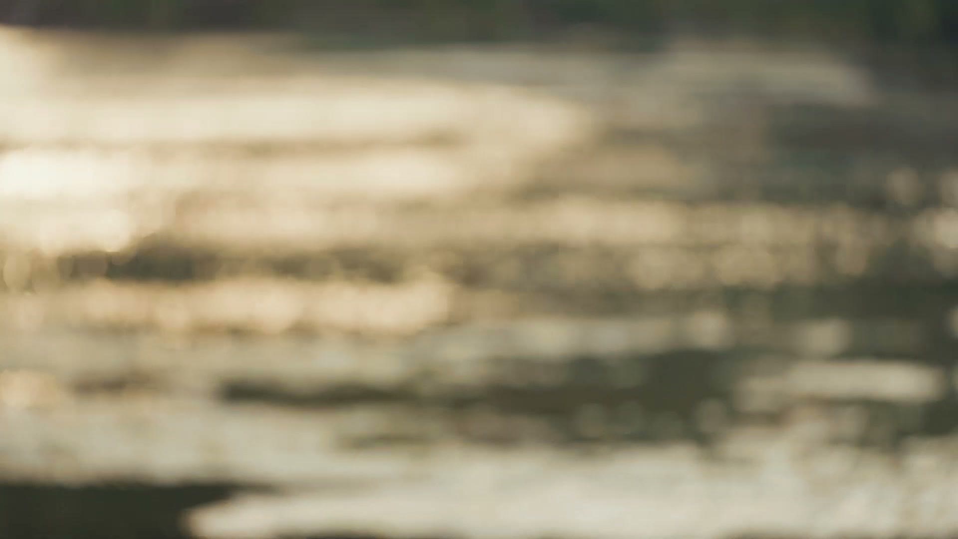 Out of focus sunlight sparkling on river water, showing the bokeh of the 70-200 F4 II