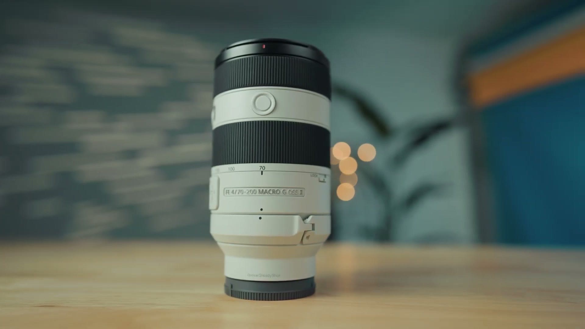 The Sony 70-200 Macro G F4 II standing upright on a table with its name badge visible