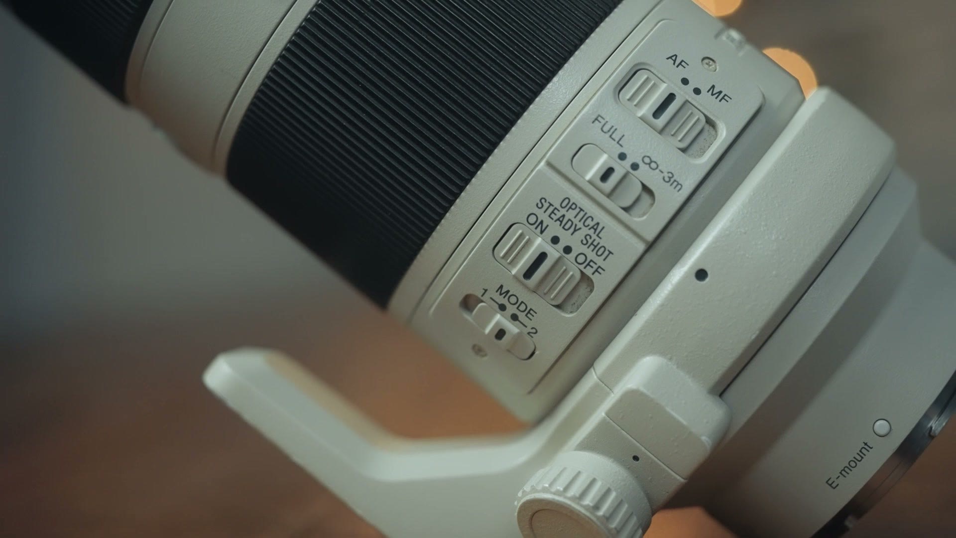 Close up of the switches on the side of the Sony 70-200 F4 lens barrel
