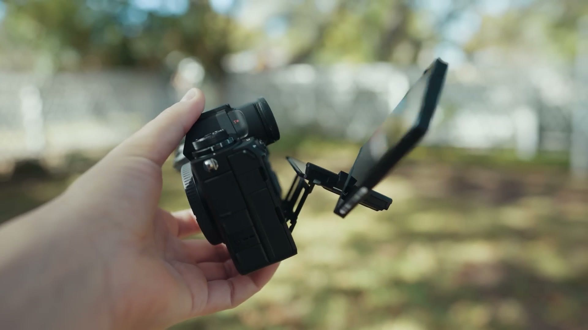 The rear screen of the Sony a1 II flipped out and articulated away from the camera body