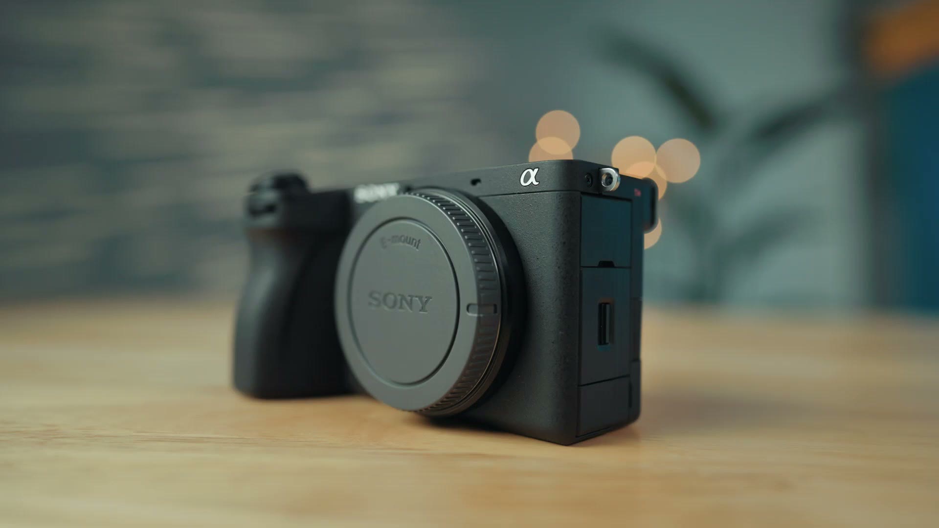 Sony a6700 camera body sitting on a wooden table