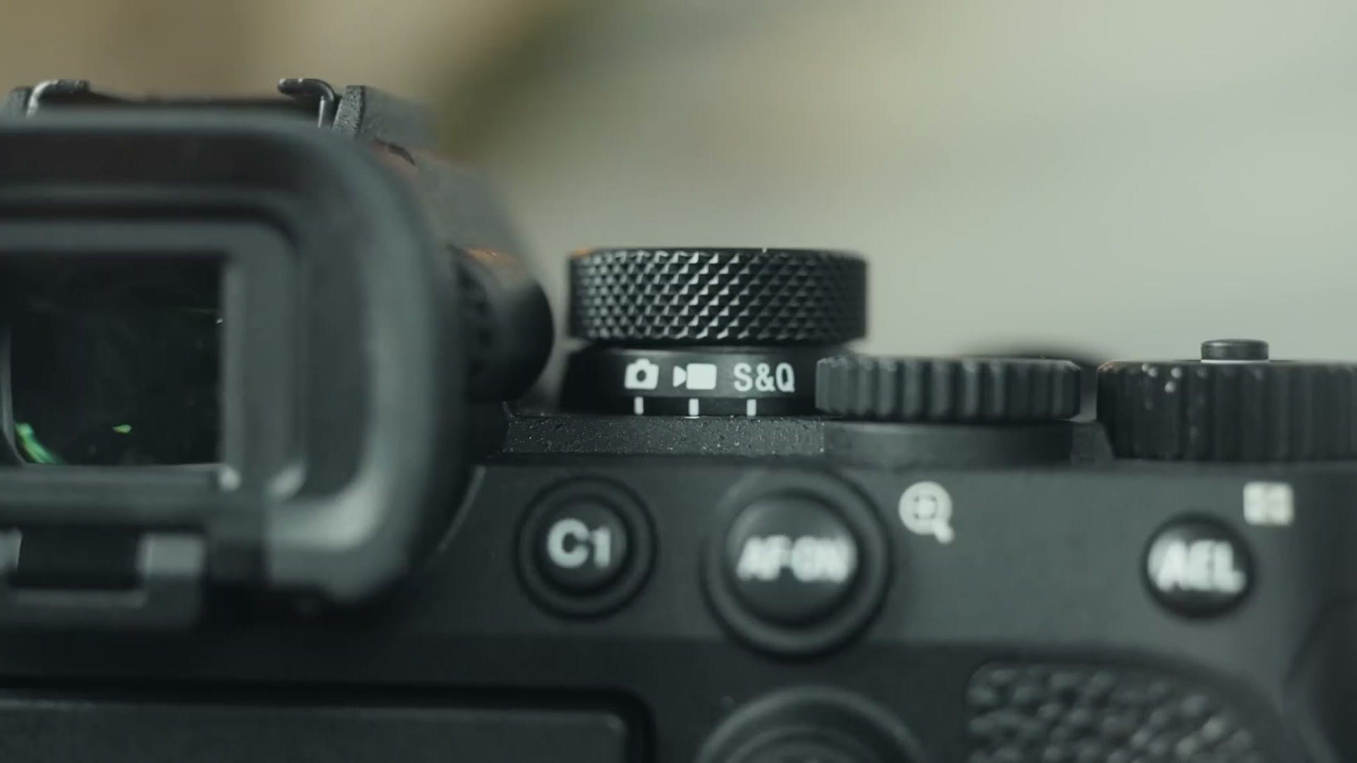 Top plate of the Sony a7 IV showing the new mode dial and locking exposure wheel