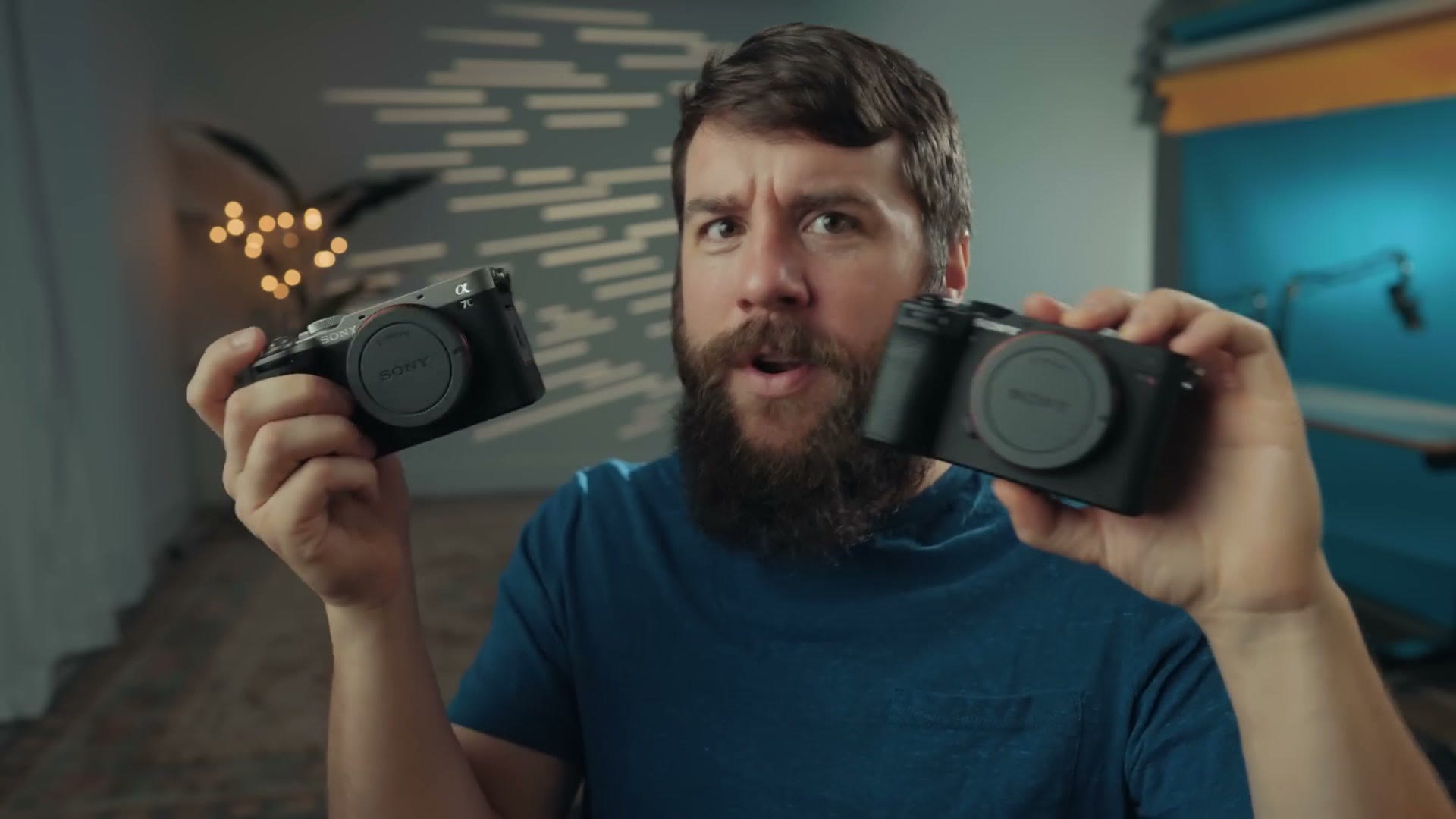 Matt holding the Sony a7C II and a7C R, one in each hand