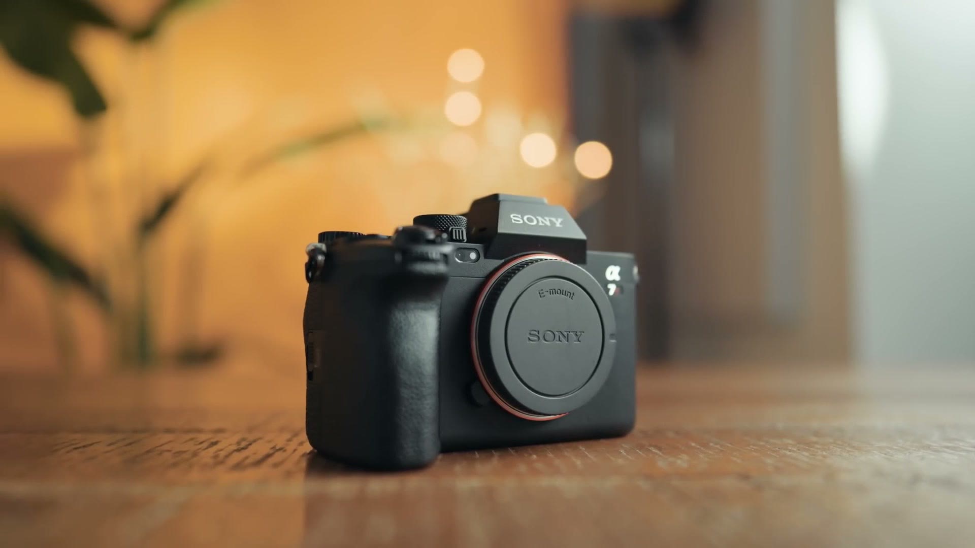 The Sony a7R V camera body sitting on a wooden table