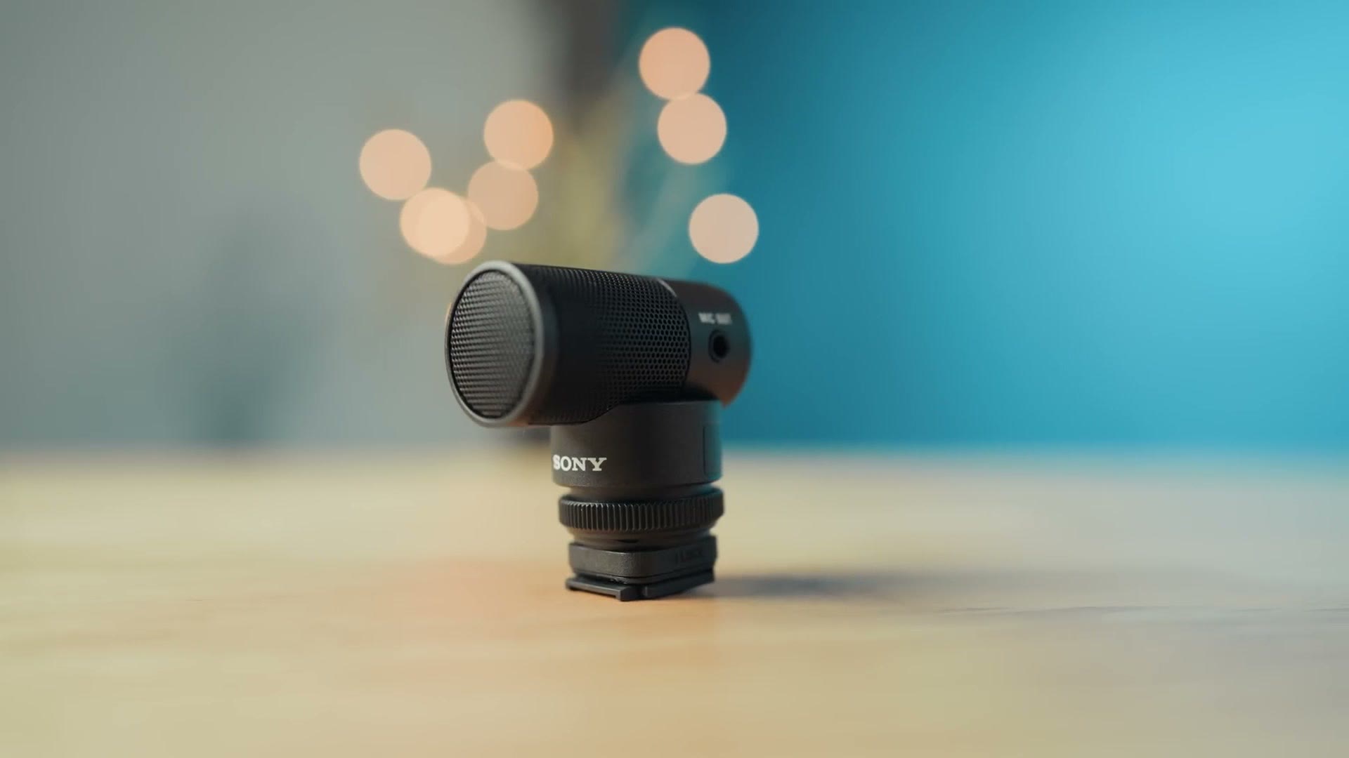Sony ECM-G1 shotgun microphone standing on a wooden table