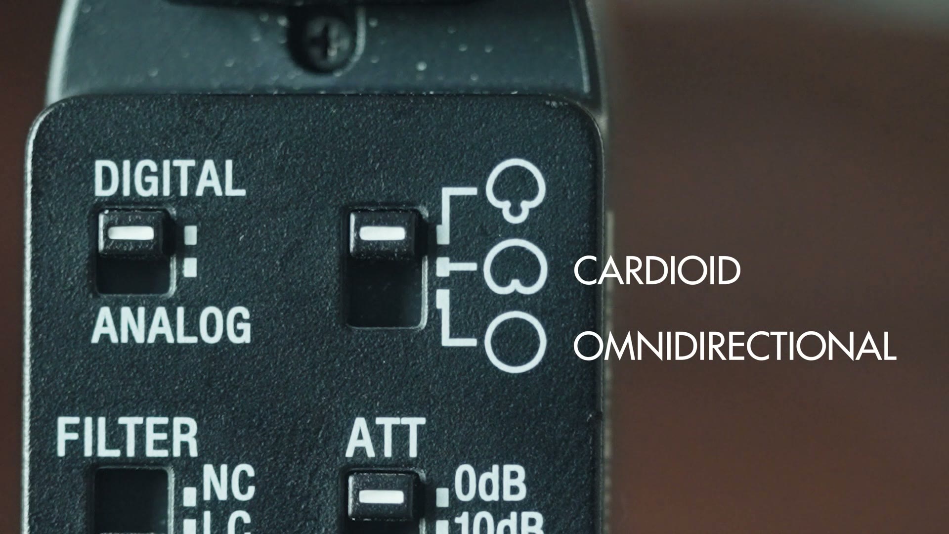 Close up of the ECM-M1 switch panel showing digital and analog, cardioid and omnidirectional, filter and attenuation switches
