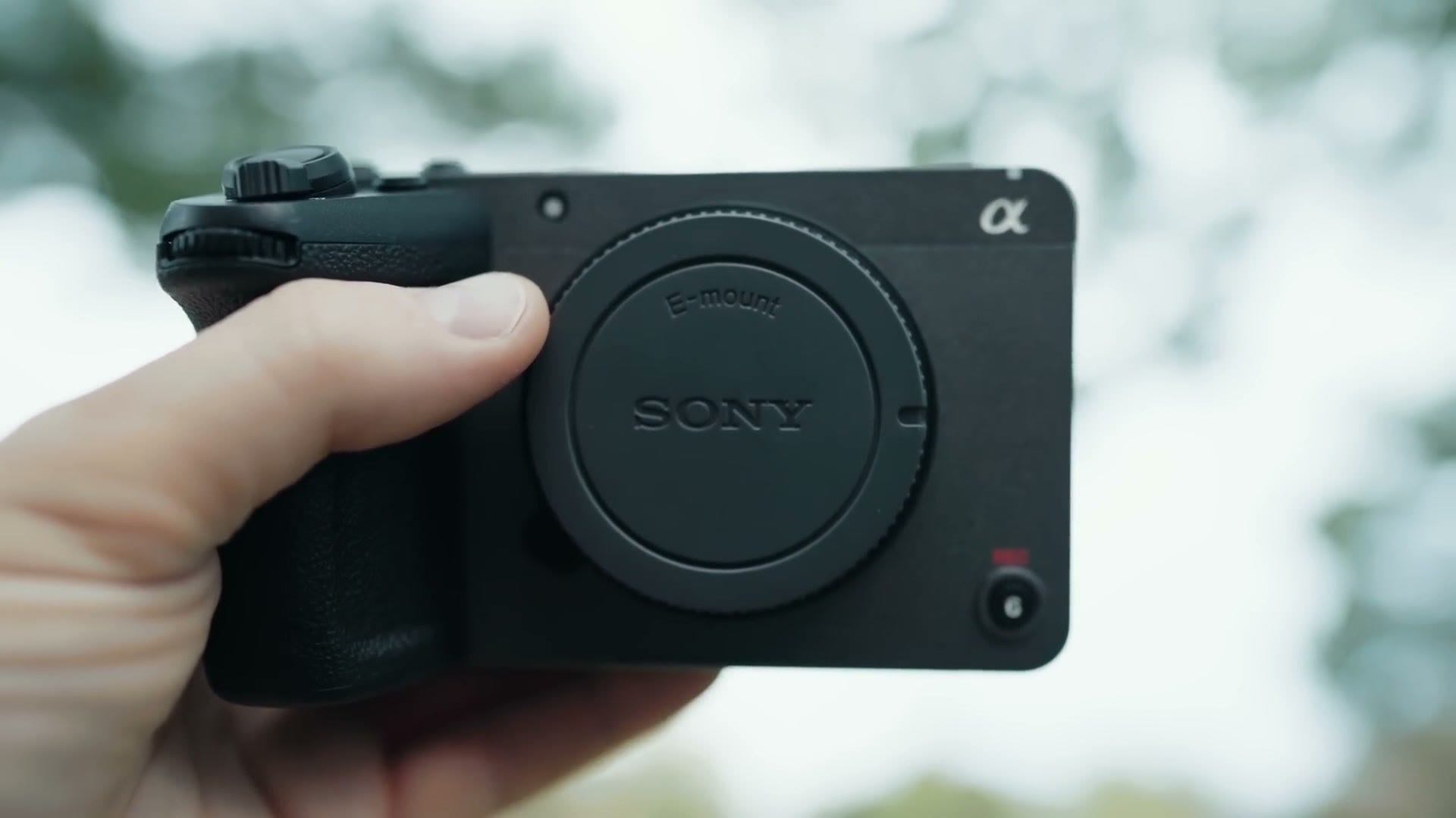 The Sony FX30 body held in one hand