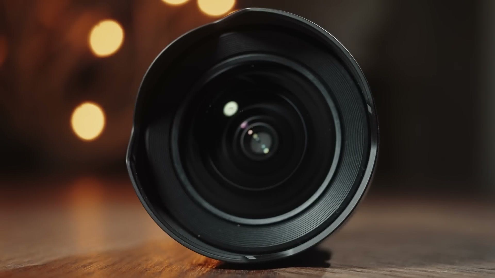 Front of the Sony 14mm f1.8 GM showing the bulbous front element inside a fixed petal hood with no filter threads