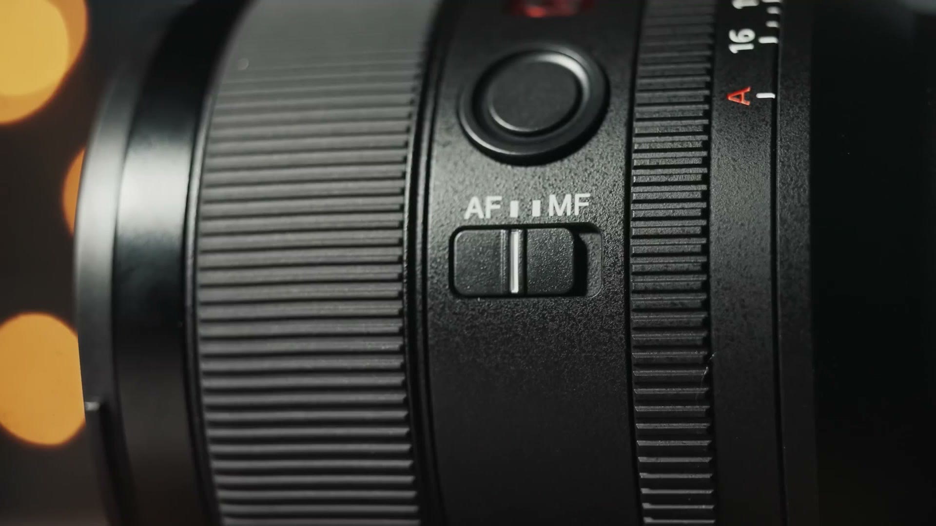 Close up of the Sony 35mm GM barrel showing the AF MF switch and the aperture ring marked to A