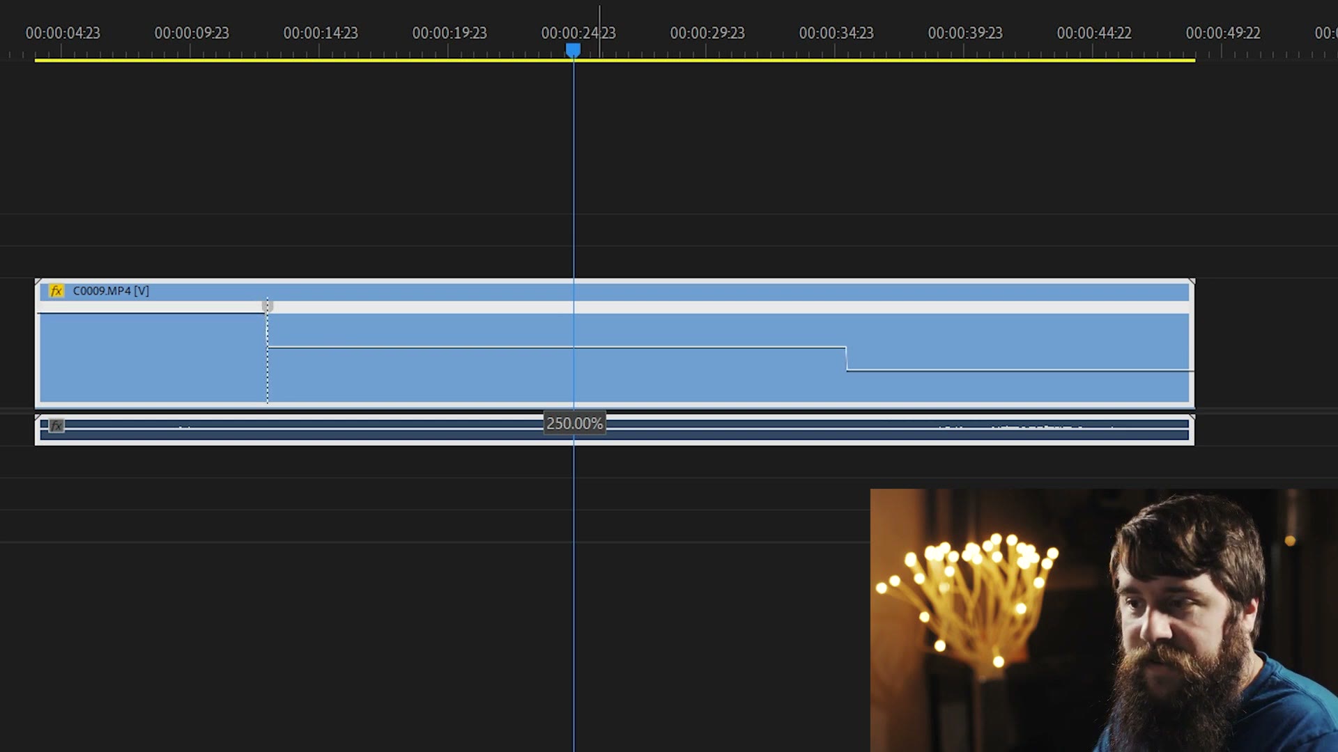 A Premiere Pro timeline clip with its speed line raised and a tooltip reading 250.00%.