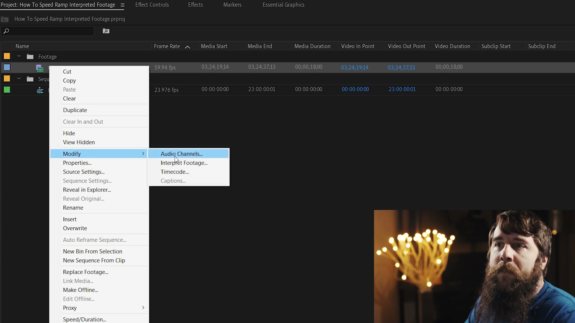 The Adobe Premiere Pro project panel with a clip right-clicked, showing the Modify submenu open and Interpret Footage listed inside it.
