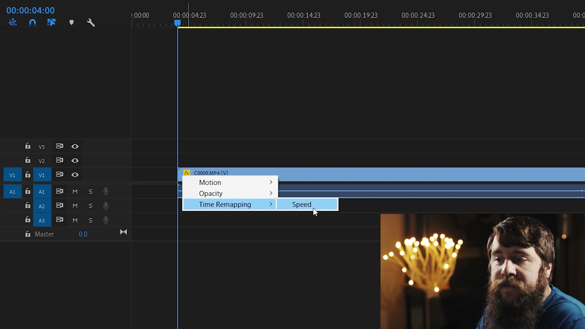 A right-click menu on a timeline clip's FX badge in Premiere Pro, with Time Remapping expanded and Speed highlighted.