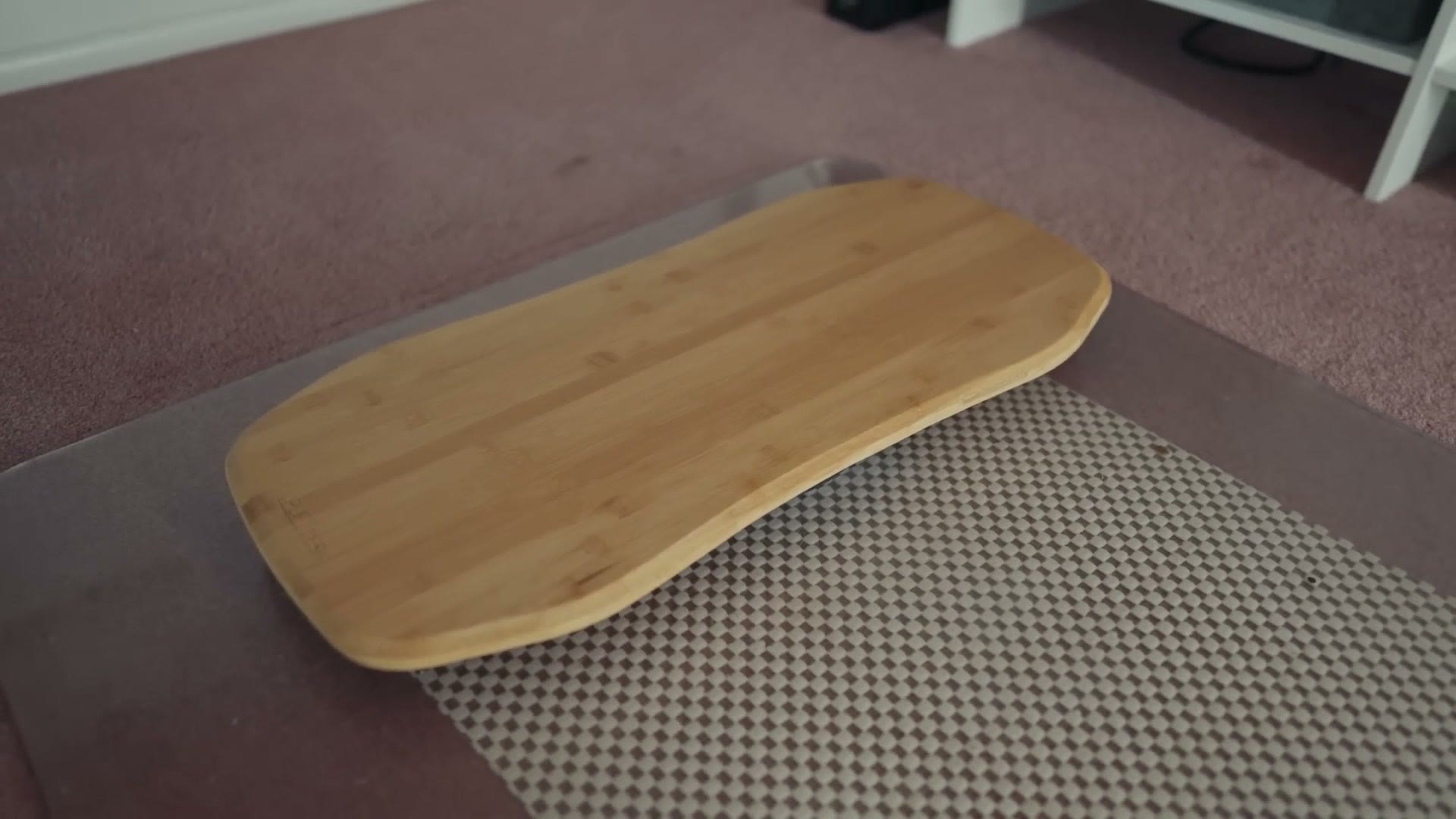 Standing on the balance board at the desk