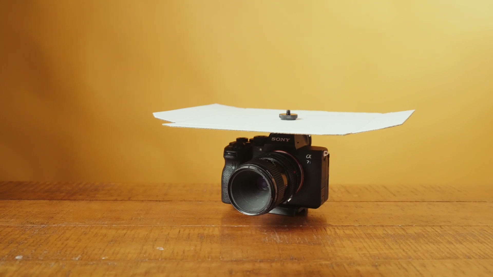 The finished sunshade mounted on top of a Sony camera