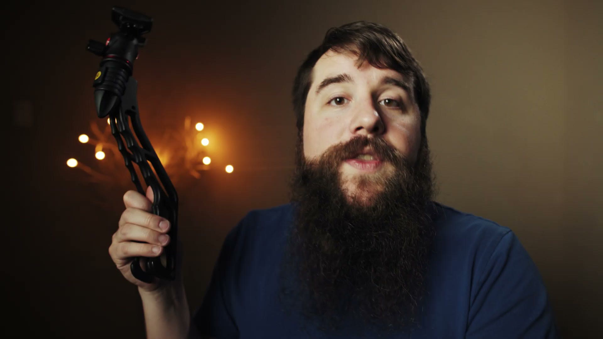 Matt holding up a folded Switchpod beside his head