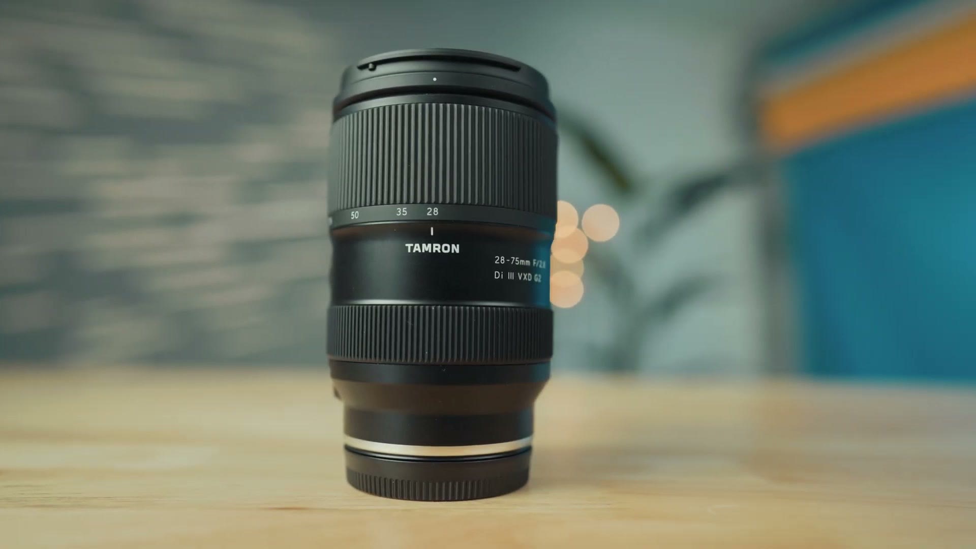 The Tamron 28-75mm F/2.8 Di III VXD G2 lens standing on a table