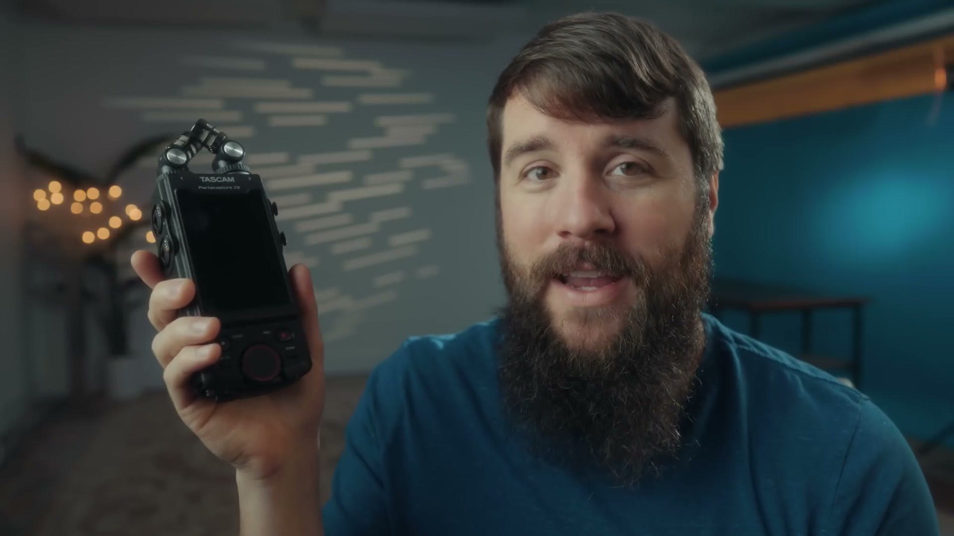 Matt Johnson holding the Tascam Portacapture X6 audio recorder