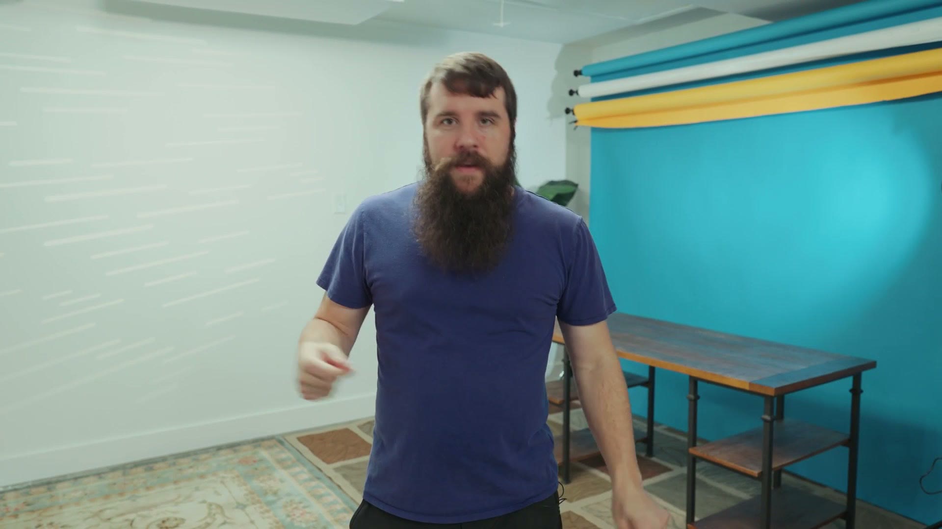 Matt holding a small thin square acoustic panel