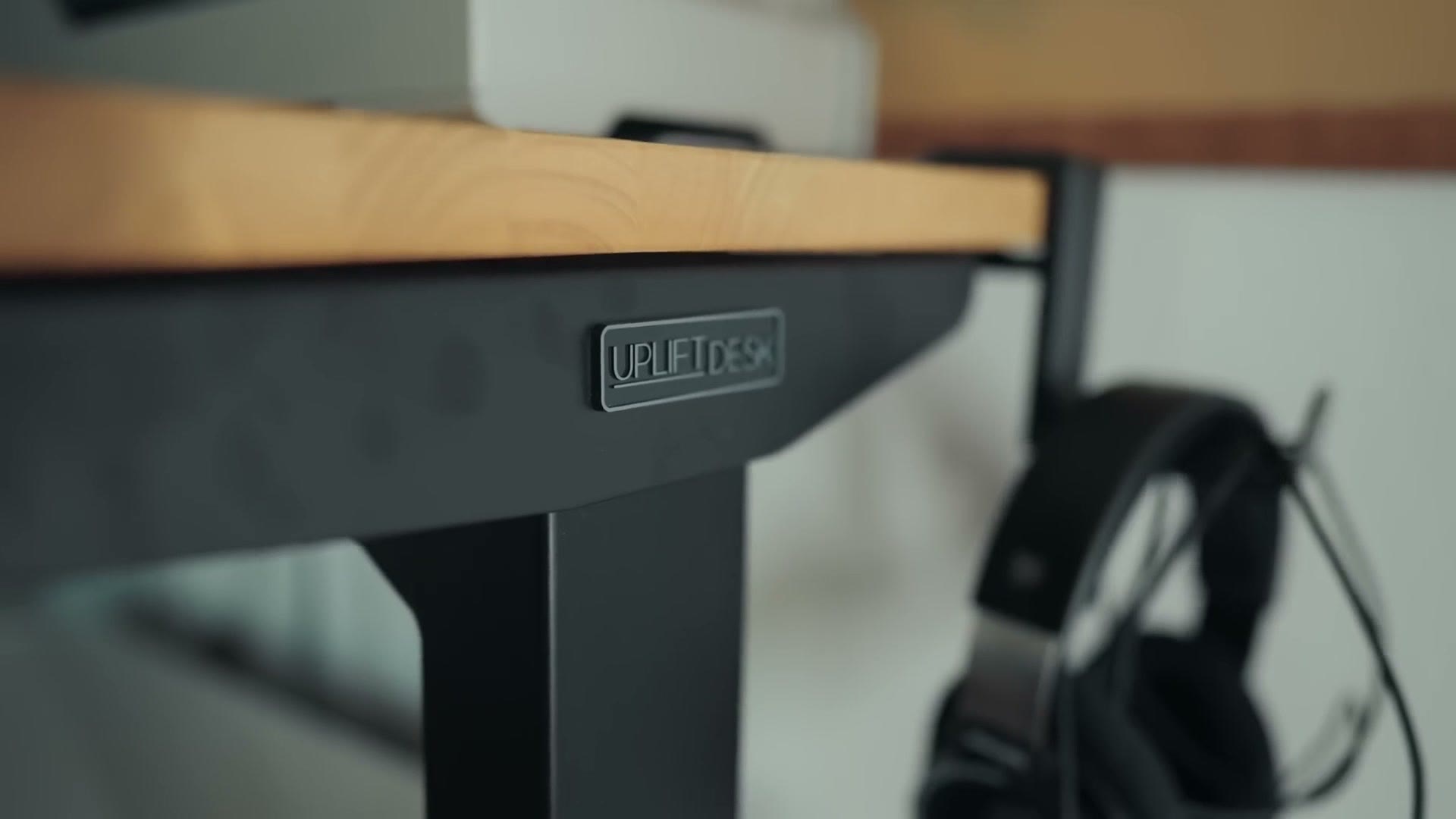 Close up of the Uplift Desk logo on the desk frame