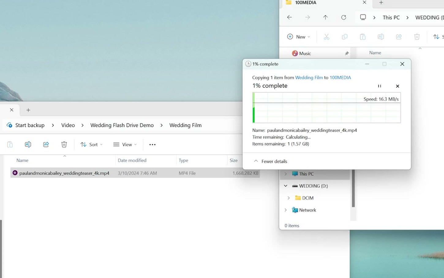Windows copying the wedding film into the 100MEDIA folder on the flash drive