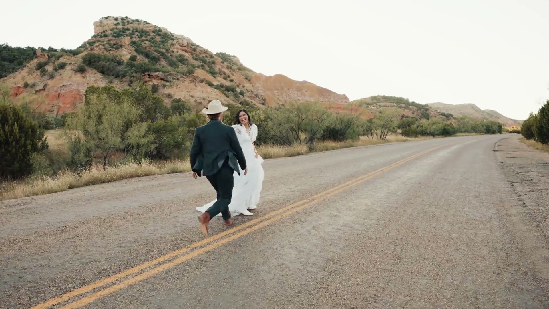The couple walking down a canyon road