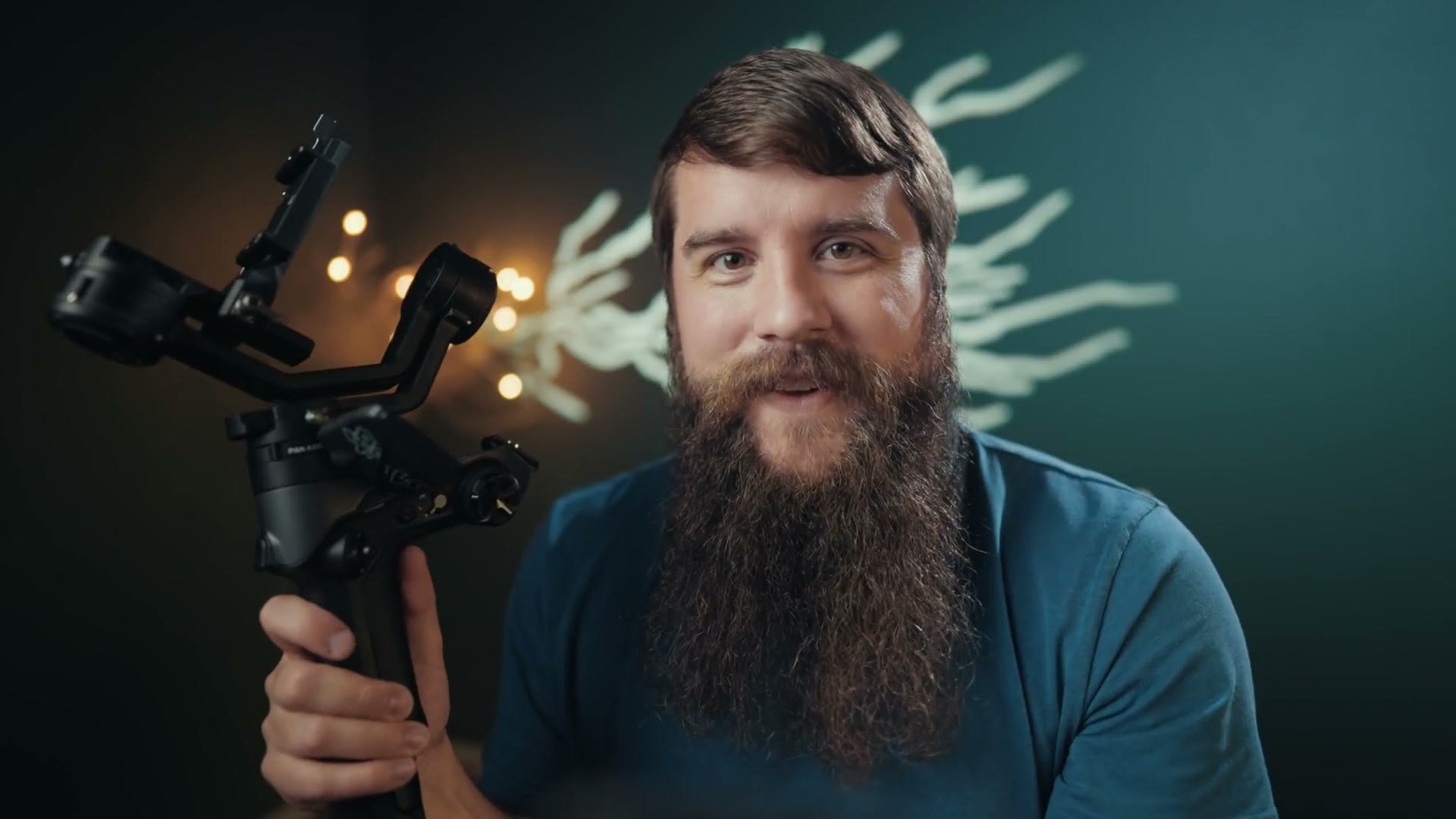 Matt holding the Weebill 2 with a camera and lens balanced on it