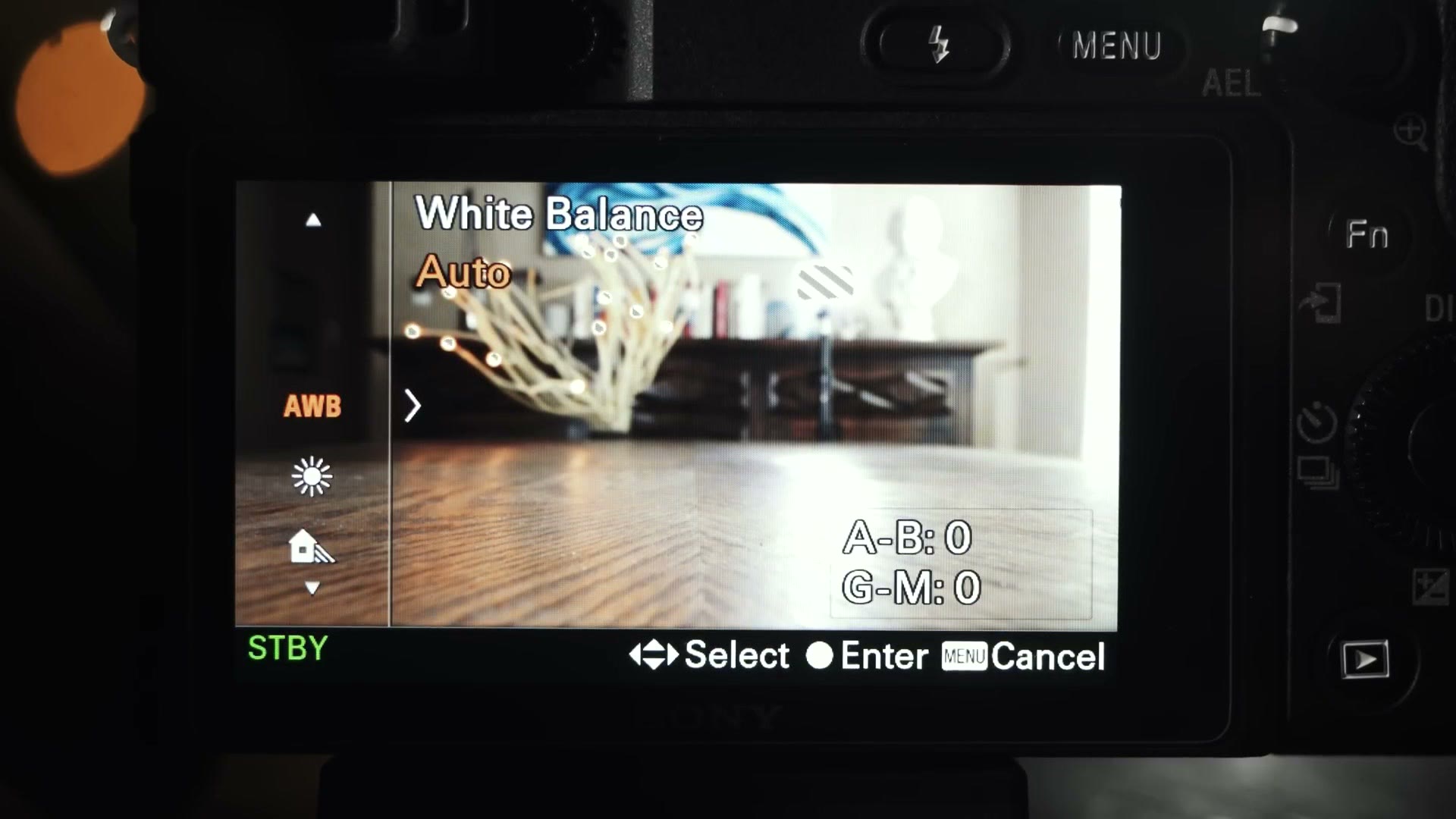 The Sony a6400 rear screen showing the White Balance menu with Auto selected and AWB highlighted.