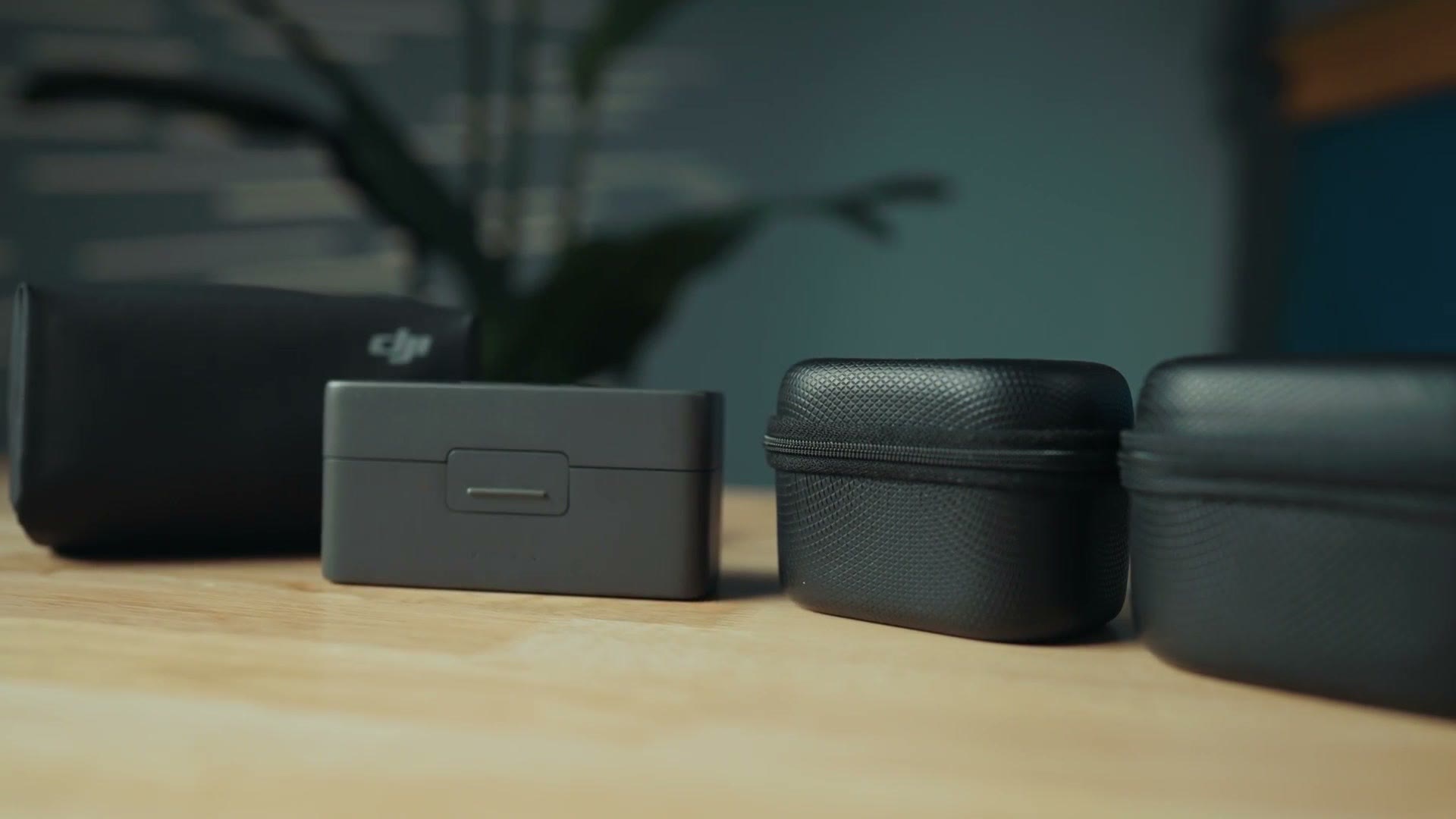 Both microphone systems' cases lined up on a table