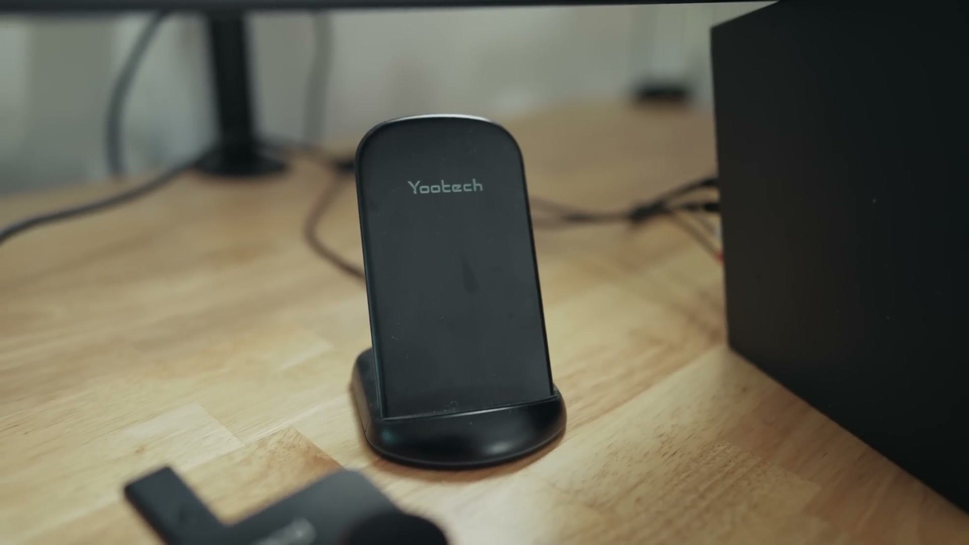Wireless phone charging stand on the desk