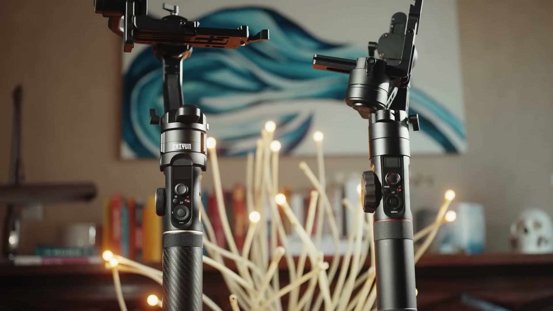 The Zhiyun Crane 2S standing next to the original Crane 2 on a table