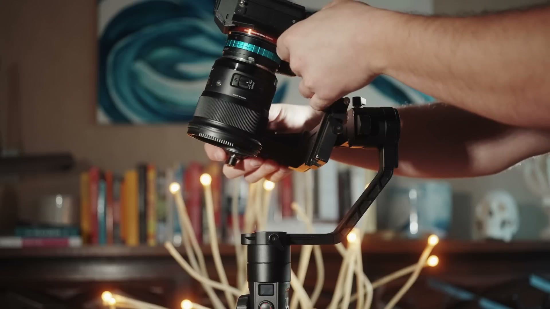 A camera being slid onto the quick release plate of the Crane 2S