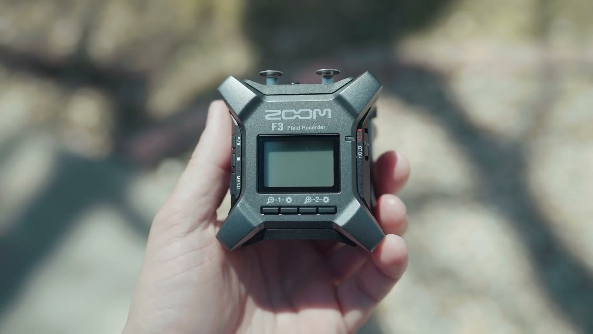 Zoom F3 audio recorder held in hand