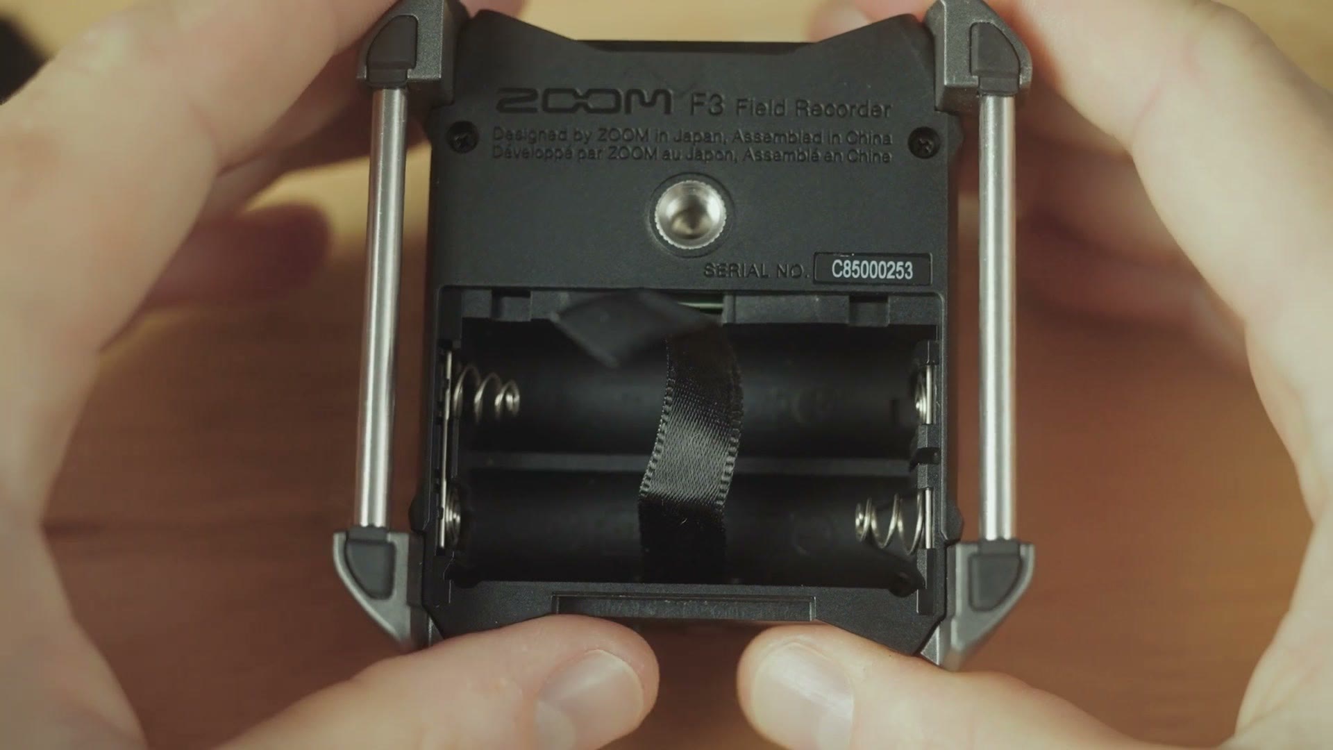 Battery compartment of the Zoom F3 open with AA batteries inside