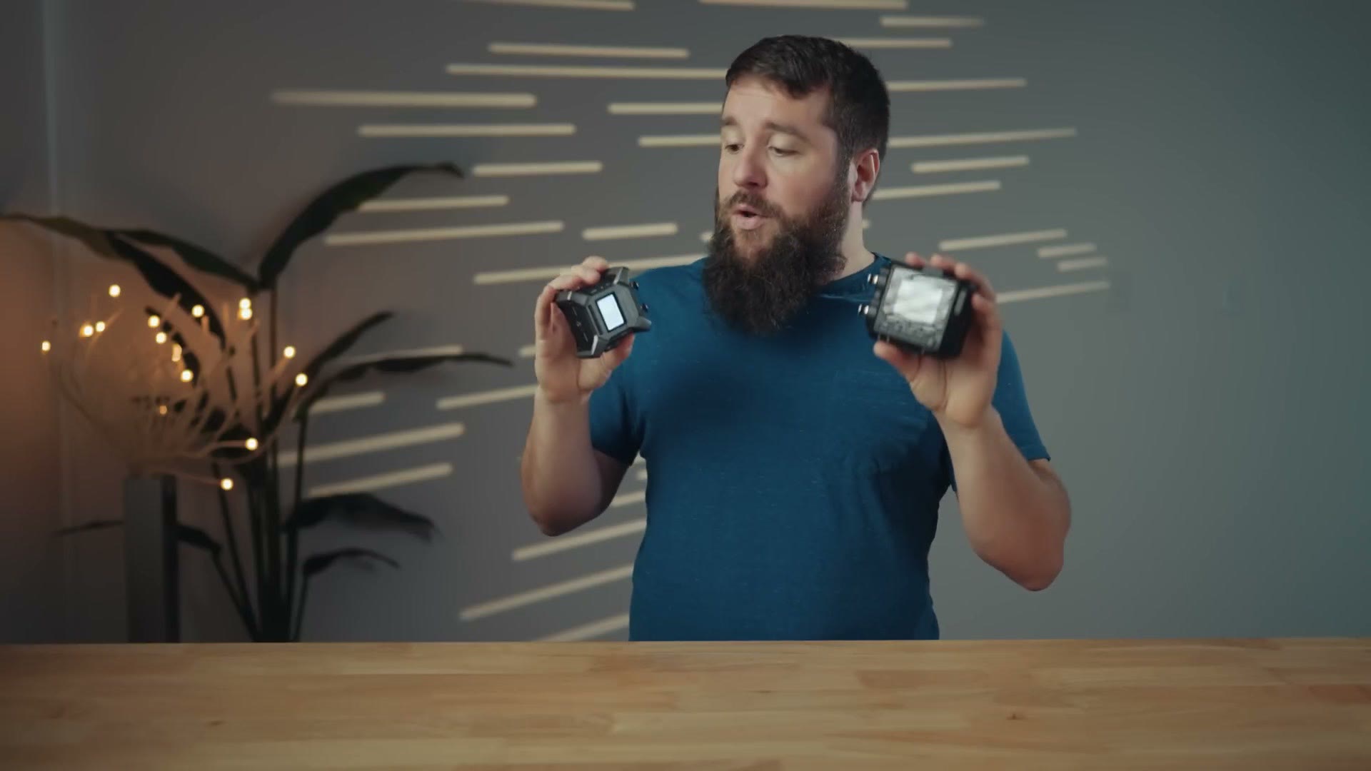 Matt holding the Zoom F3 in one hand and the Tascam FR-AV2 in the other