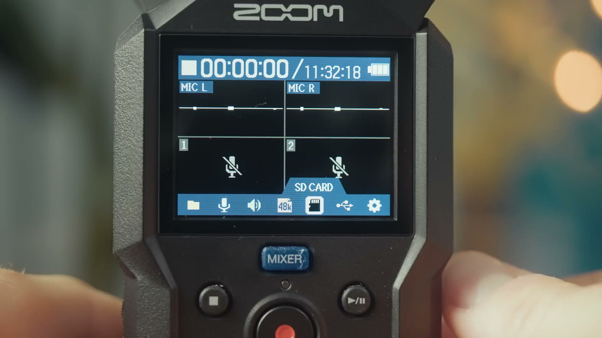 Zoom H4essential screen showing MIC L and MIC R waveforms with the MIXER button below