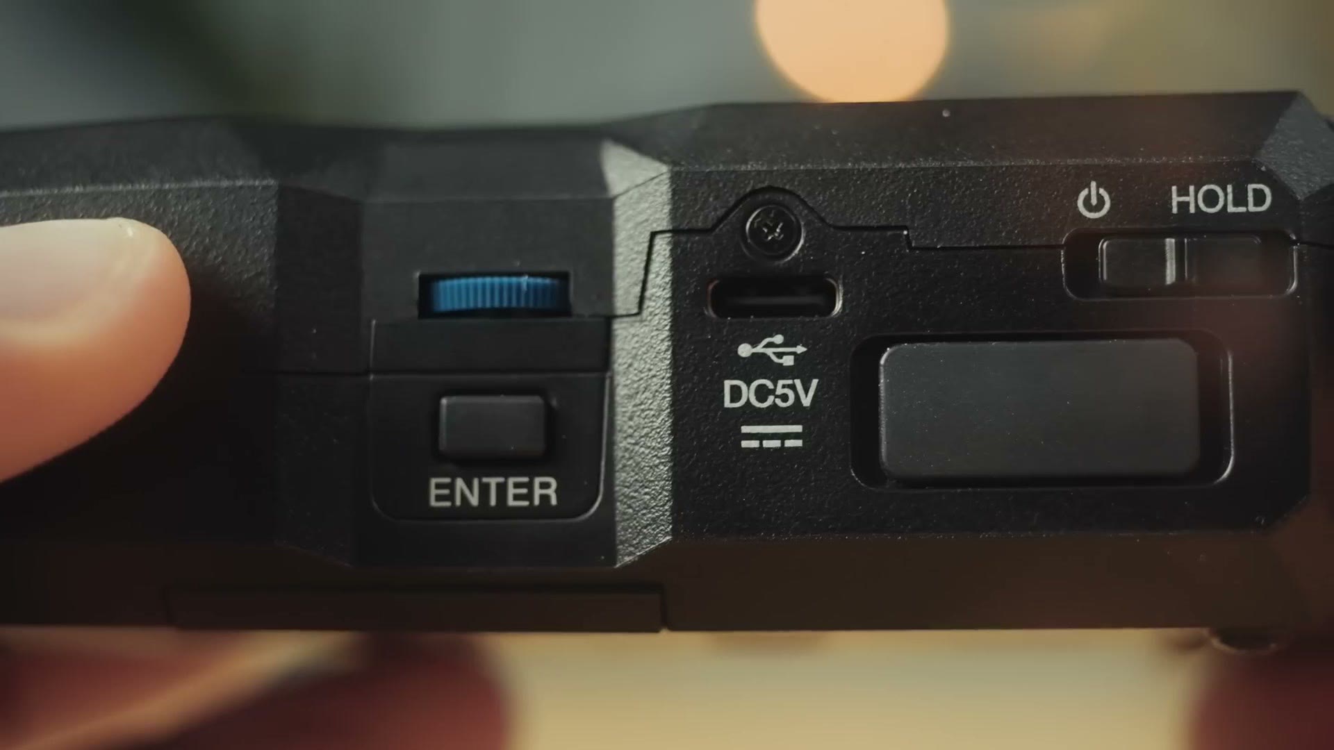 Side of the Zoom H4essential showing the scroll wheel, ENTER button, USB-C port, DC5V and HOLD switch