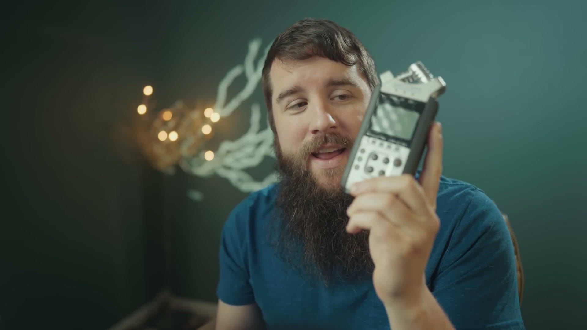 Zoom H4n audio recorder held in hand