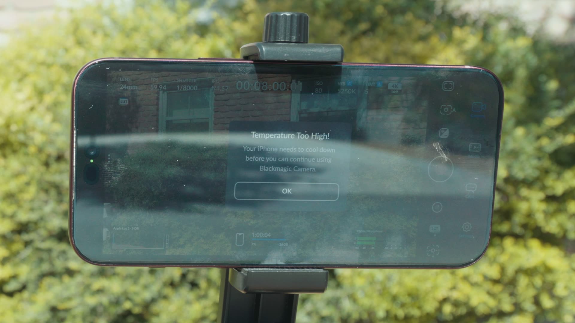 Blackmagic Camera app on iPhone showing a Temperature Too High warning telling the user the iPhone needs to cool down