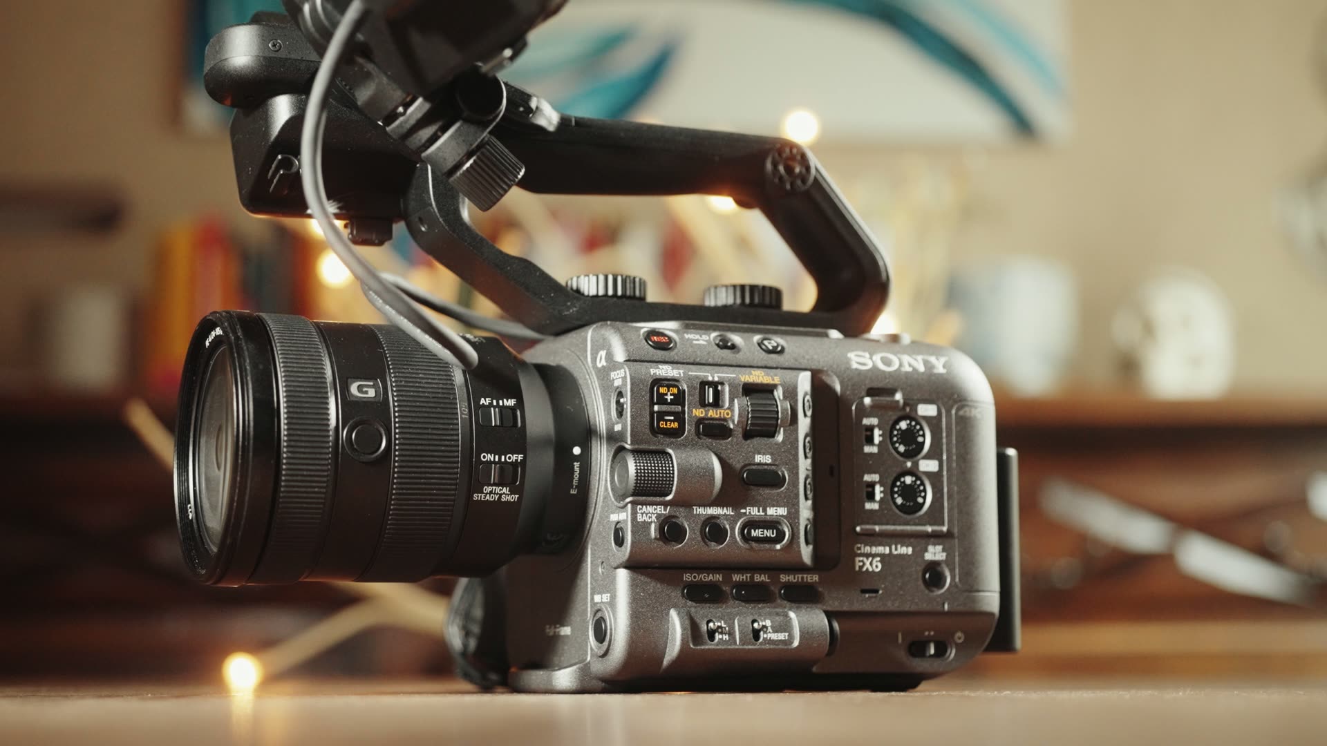 Sony FX6 cinema camera rigged with its top handle and a Sony G zoom lens, side control panel facing camera