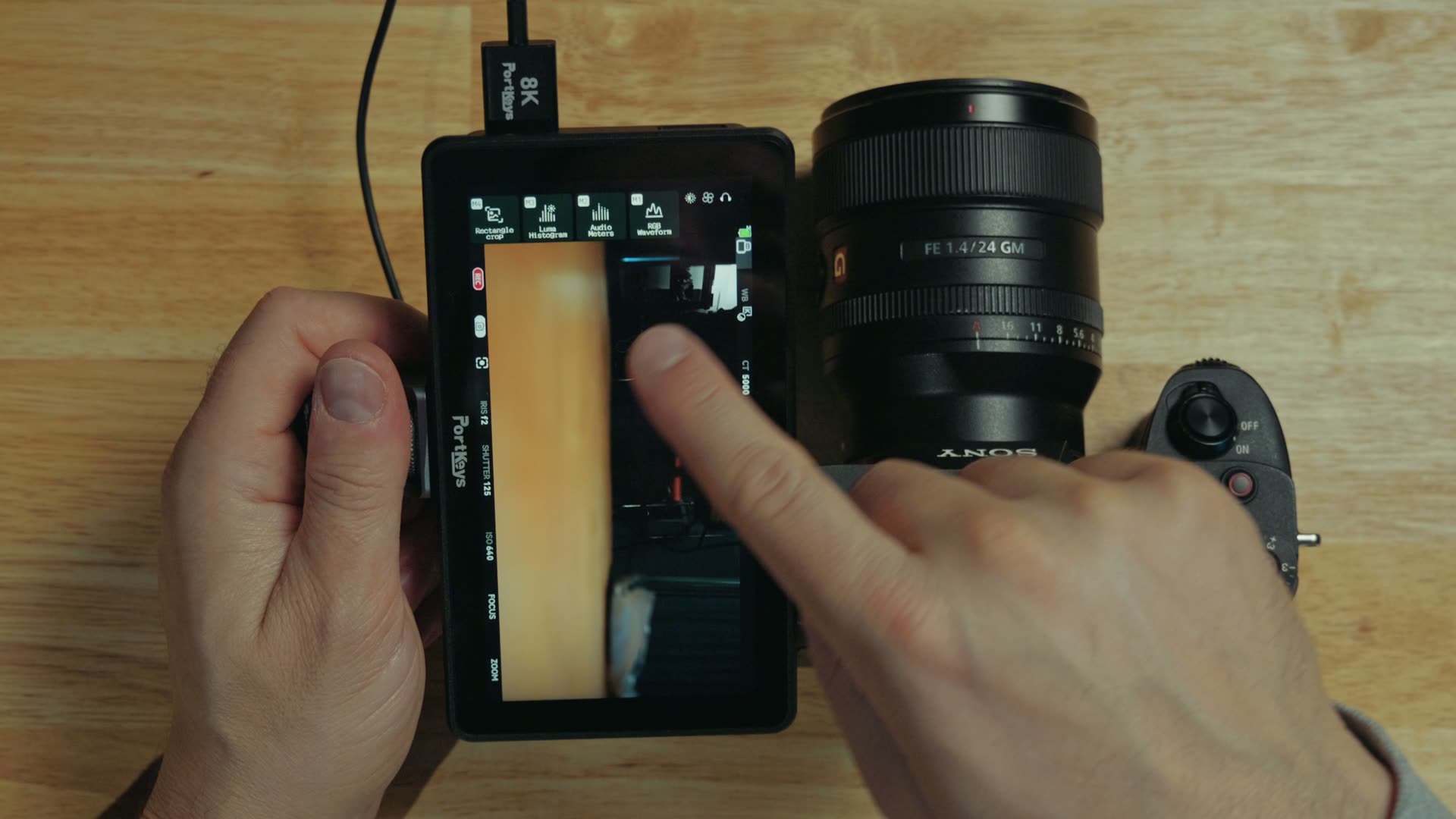 The Portkeys LH5P III mounted vertically with its shortcut buttons rotated for vertical video