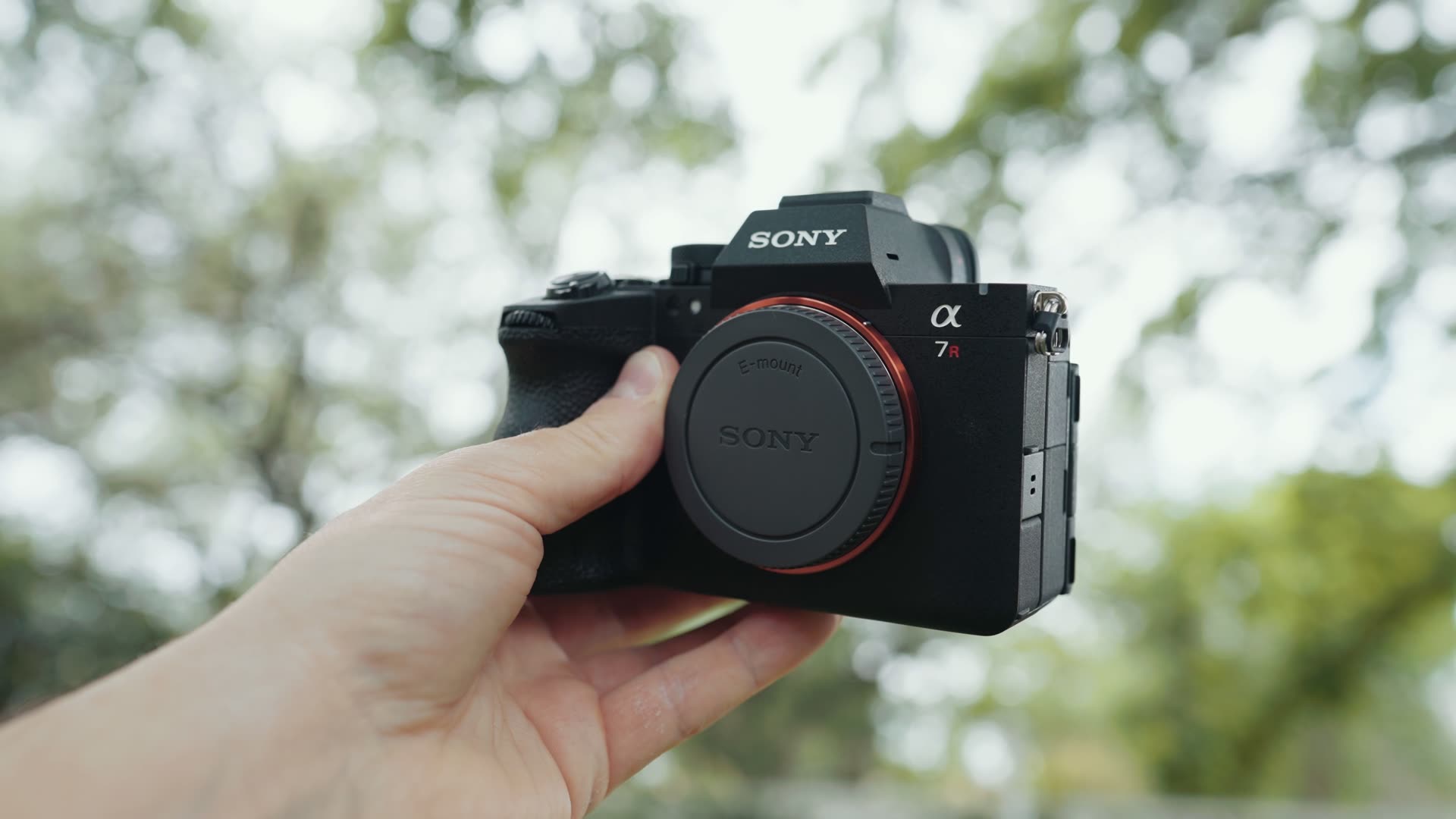 Sony a7R VI camera body held outdoors, the body style a Sony a7S IV would most likely reuse