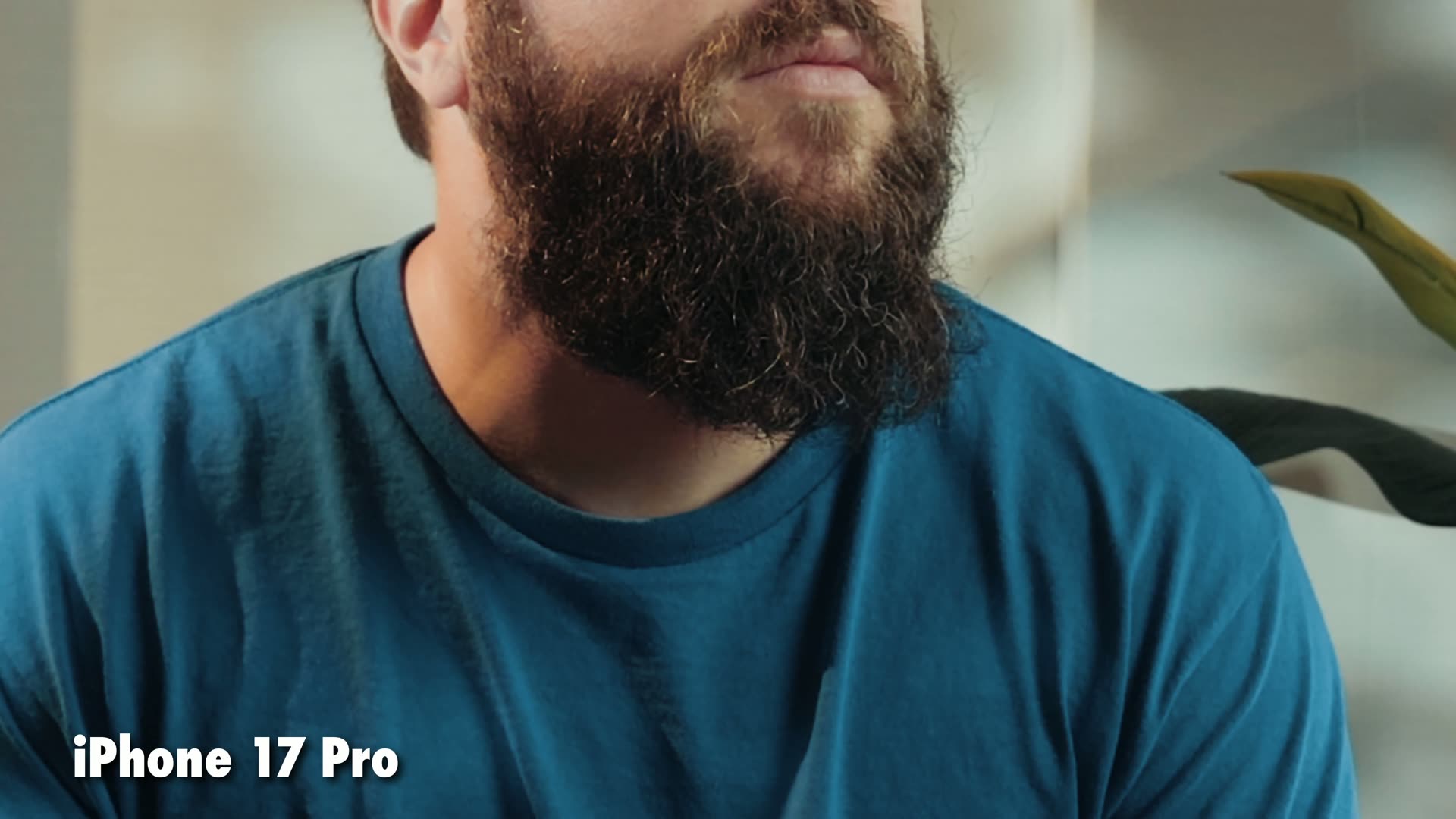 Close-up of a bearded man filmed on the iPhone 17 Pro at F1.78