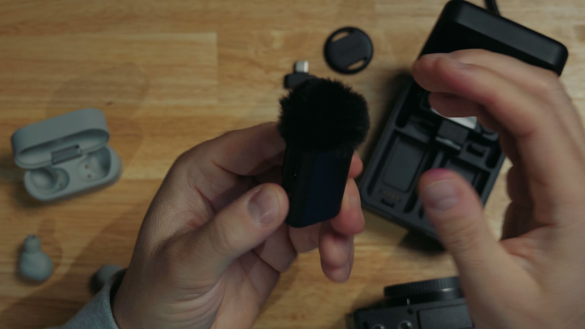 Sony ECM-W5 transmitter with its furry wind muffler attached through the mic jack